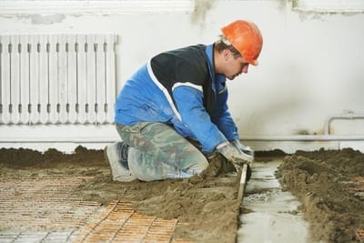Employee from Gladstone Concreters working on the concrete of a house